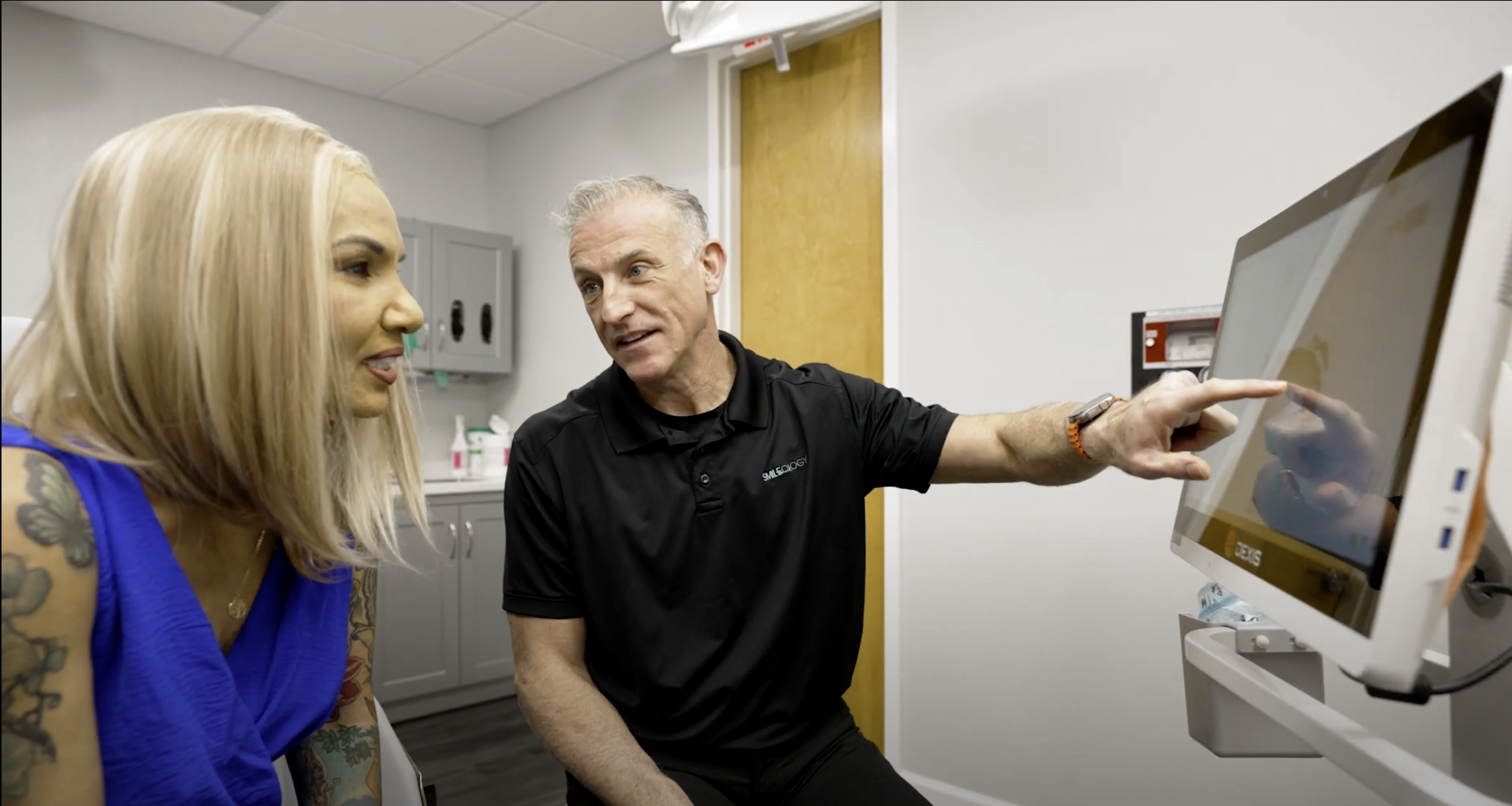 Niceville dentist Dr Broutin explaining implant supported dentures vs traditional dentures